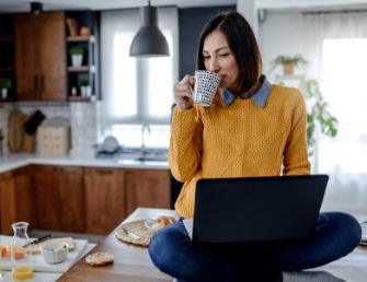 Female - In Kitchen on Laptop